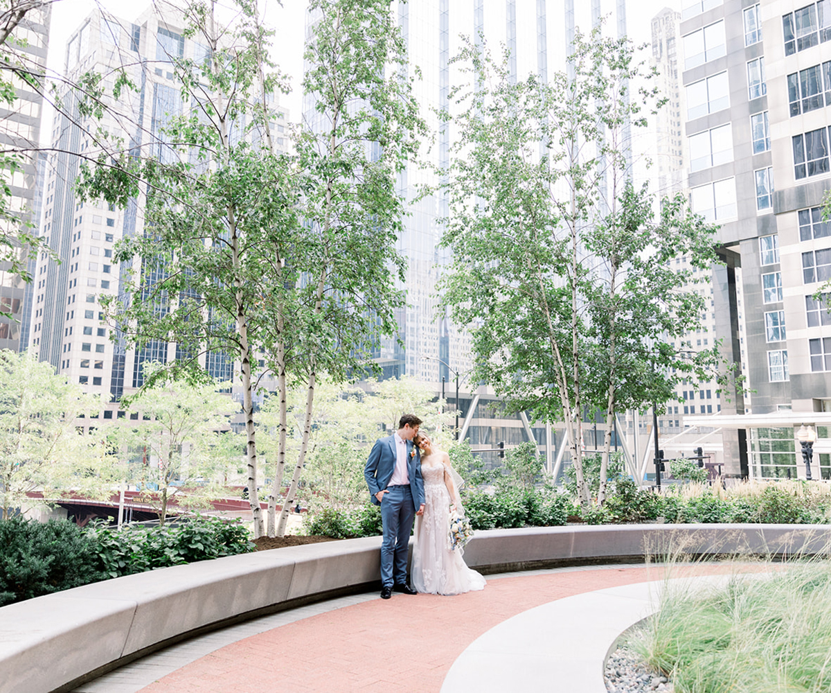 A bride and groom pose in one of 150 Riverside's courtyards